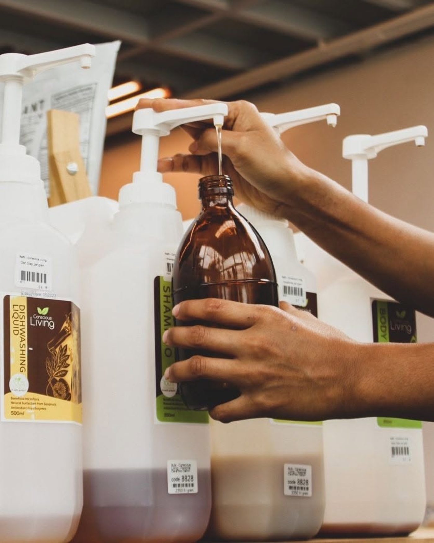 Refill station at Samui Health Shop, refilling shampoo and conditioner by weight
